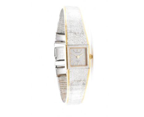 A Seiko 1e20 5020 &nbsp;430599 Ro watch. The Seiko watch having a square face with white and yellow metal body and strap with