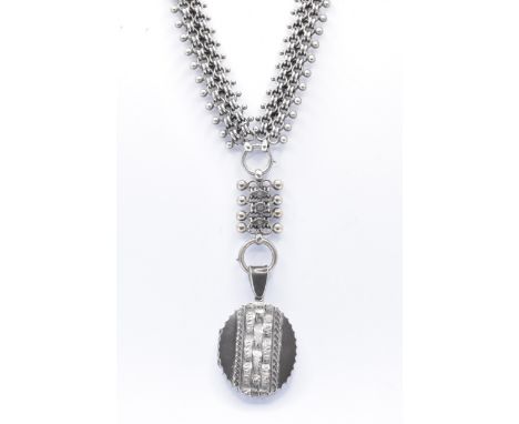 A 19th Century Victorian silver locket and collar necklace. The necklace having a pierced decorative link with an oval locket