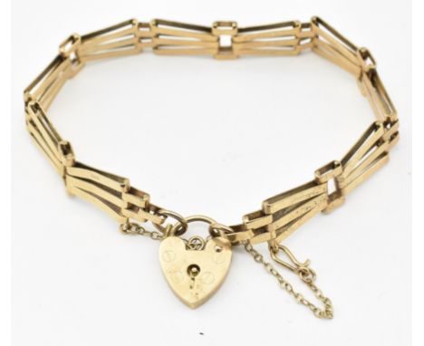 A hallmarked 9ct gold Art Deco style bracelet. The bracelet having geometric sunburst links united by heart lock fastener wit