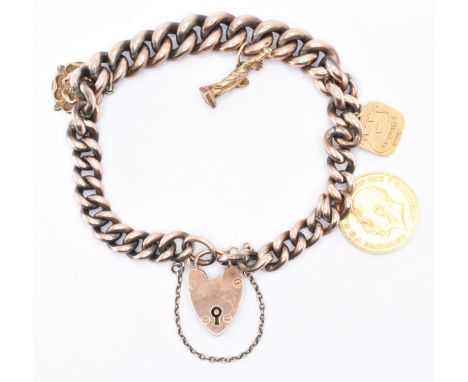 A vintage charm bracelet having a gold plated curb link bracelet, with a 9ct gold heart padlock, 1914 half sovereign, a 14ct 
