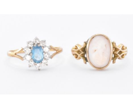 Two 9ct gold rings. A hallmarked&nbsp; topaz cluster ring set with a central oval cut blue topaz framed by round brilliant cu