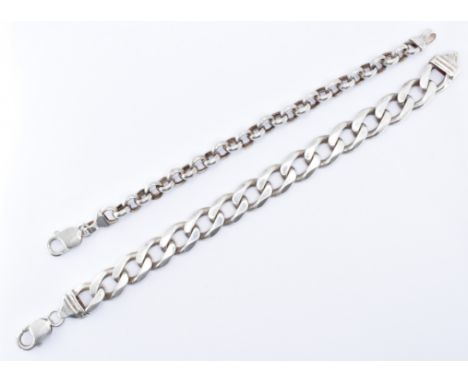 A pair of silver bracelets to include an Italian flat curb link gents bracelet and a belcher chain bracelet. Longest measures