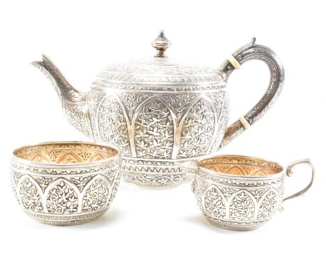 A 19th century Victorian silver hallmarked 3-piece tea service comprising teapot, sugar bowl and creamer jug. The set having 