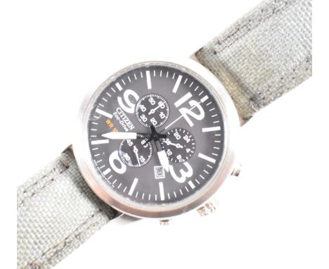 A Citizen Eco Drive WR 100 gentleman's wrist watch having a round face with a brown dial, large Arabic and baton numerals to 
