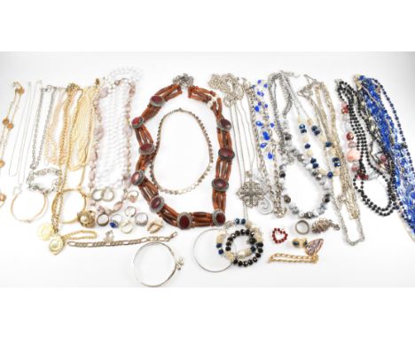 A collection of vintage costume jewellery to include a wide election of beaded necklaces, chain necklaces, rings (some being 