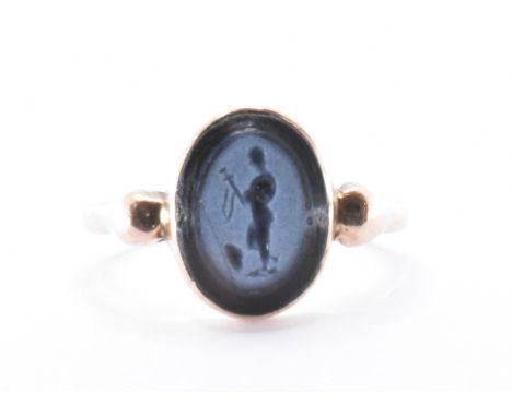 A 19th century 9ct gold and agate intaglio ring. The ring set with an agate intgalio incised with the image of a warrior. Unm