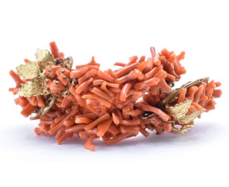 A vintage Frank Hess / Miriam Haskell spezzati coral coil bangle bracelet. The bangle&nbsp; having gold tone filigree and fol