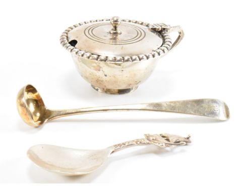 A silver hallmarked Scottish silver mustard pot having a hinged lid and beaded borders. Together with a silver viking ship sp