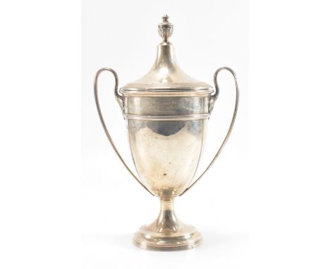 A 1930s Adie Brothers silver hallmarked lidded trophy. The trophy having a lidded top with urn shaped finial, twin handles, e