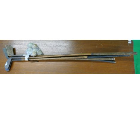 Hickory golf clubs and vintage balls