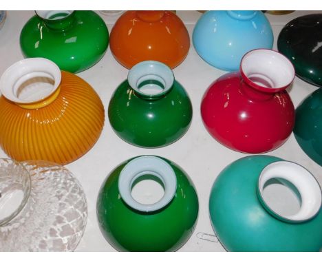 Glass oil lamp shades, various colours, one fluted, another with a honeycomb effect. (15)
