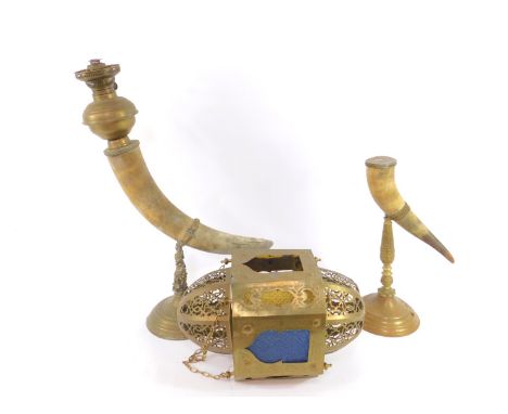 A brass and horn oil lamp, raised on an embossed clam stem and stepped circular foot, 70cm high, a further brass and horn oil