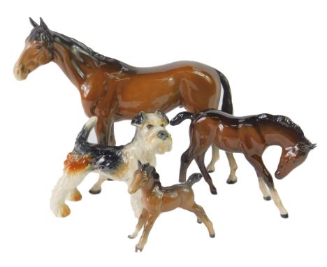 A Beswick brown gloss horse, together with two ponies, and a Goebel figure of a terrier. (4)