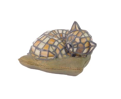 A Tiffany style glass and plaster table lamp, modelled as a kitten recumbent on a cushion, 17cm long.