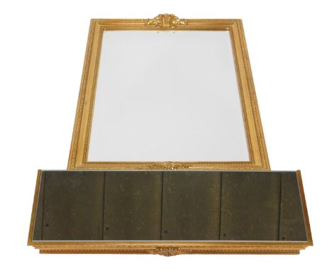 A rococo style gilt wall mirror and console table, the mirror of rectangular form with inset bevelled glass above a console s