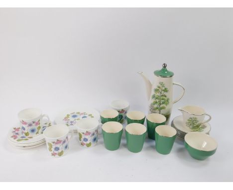 A set of four Hostess coffee cups and saucers decorated in the Angelique pattern, designed by John Russell, together with thr