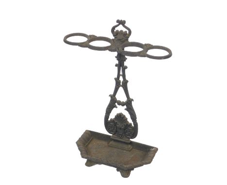 A Victorian cast iron umbrella and stick stand, with foliate casting, four recesses. 69cm H, 48.5cm W, 20cm D.