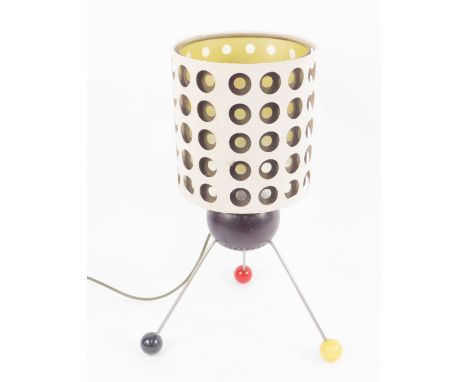 An Atomic style table lamp, the body formed as a bowl, raised on three metal rod and coloured ball feet, with a bi-coloured c