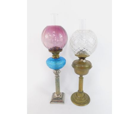 A Corinthian column oil lamp, white metal with a faux marble stem, blue glass reservoir, with chimney and amber glass globula