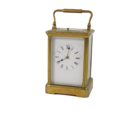 A late 19thC brass cased repeater carriage clock, enamel dial bearing Roman numerals, twin barrel movement with coil strike o
