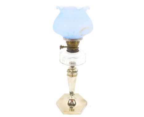 A duplex silver plated oil lamp, of hexagonal baluster form, with cut clear glass reservoir, and a mottled blue glass shade, 