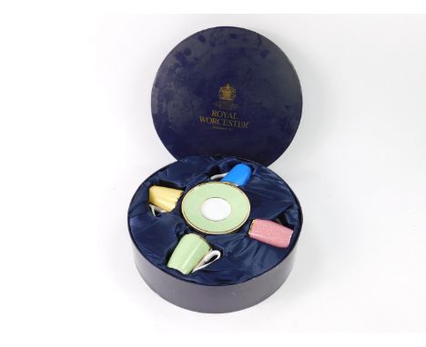 A Royal Worcester porcelain demi-tasse Harlequin part coffee set, decorated with seaweed, in celebration of HRH 80th Birthday