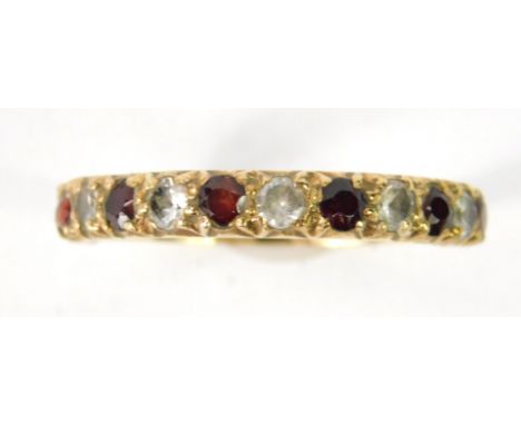 A ruby and zirconia half eternity ring, set in yellow metal stamped 9ct, size N, 1.1g