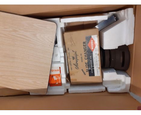 A vintage Corona typewriter together with a vintage enlarger 66 in original box and a vintage Plus machine and a vintage Adle