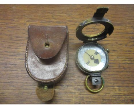 A WWI period Short & Mason prismatic marching compass in leather case Location: Cab 