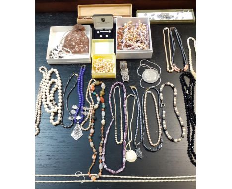 A quantity of mainly mid to late 20th Century costume jewellery to include faux pearl and hard-stone necklaces and a white me