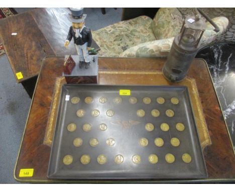 A Couroc's satin finish black plastic tray inset with American coins commemorating the Presidents of the USA, a reproduction 