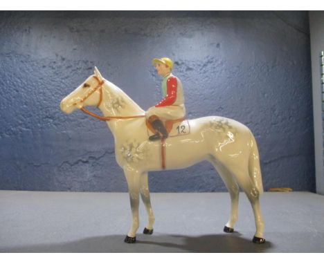 A Beswick Horse and Jockey, model no 1862, modelled by Arthur Gredington, style two, the standing horse in light dappled grey