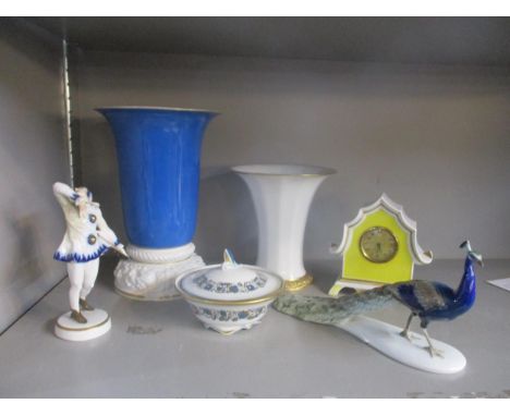 A group of Rosenthal ornaments to include a model of a peacock designed by Gustav Oppel, a dressing table clock, a powder bow