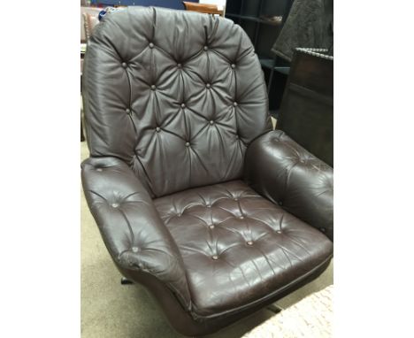 SCANDINAVIAN MODERNIST STYLE BROWN LEATHER STUDDED SWIVEL ARMCHAIR
with studded back and seat, on a five piont chrome stand, 