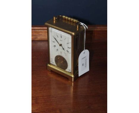 20TH CENTURY GERMAN BRASS CARRIAGE CLOCK
by Schatz, signed keyless wind movement with visible escapement, signed white dial w