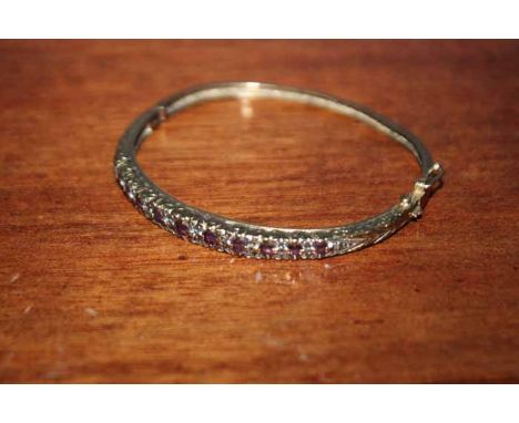 VICTORIAN GOLD SPINEL SET BANGLE
with detailed scroll work to setting