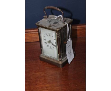 TWENTIETH CENTURY FRENCH BRASS CARRIAGE CLOCK unsigned two train movement striking on a gong, white dial with Roman numerals,