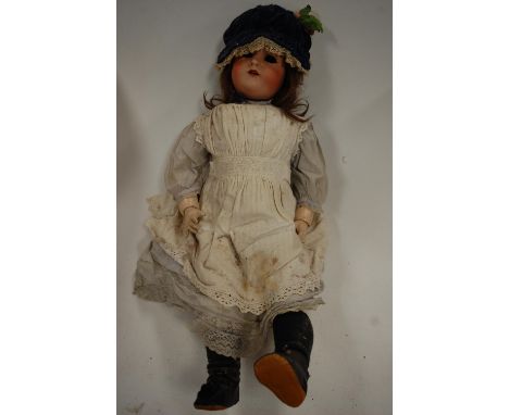 A Kammer &amp; Reinhardt for Simon &amp; Halbig bisque head doll, lacking eyes, having open mouth with four top teeth showing