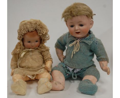 An Armand Marseille bisque head doll, having rolling blue eyes and open mouth with two top teeth showing, with jointed compos