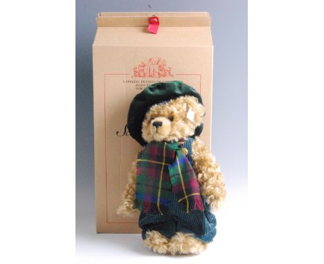 A modern Steiff The Steiff Scottish Bear, in blonde mohair with button to ear and white tag no. 654732, limited edition no. 0