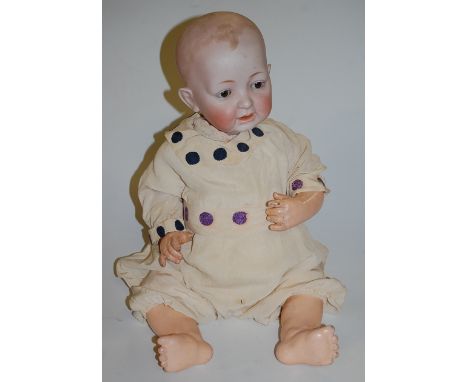 A Johann Daniel Kessler German bisque head doll, having rolling brown eyes with open mouth and two bottom teeth showing, havi