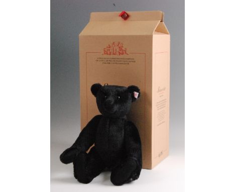 A modern Steiff Teddy Bear Schwarzbar, in black mohair with button to ear and white tag no. 660627, limited edition no. 01007