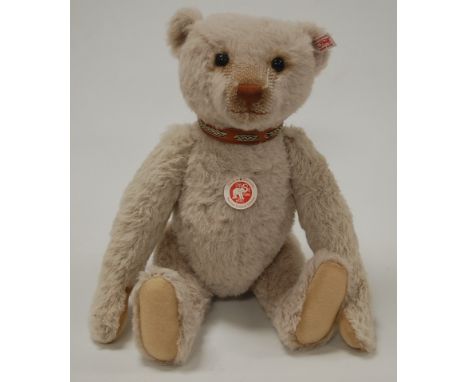 A modern Steiff 'Bastian The Nostalgia' teddy-bear, in crème mohair, with button in ear, growler and jointed limbs, limited e