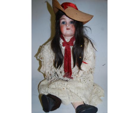 A Kammer &amp; Reinhardt for Simon &amp; Halbig bisque head doll, having rolling blue eyes and open mouth with six top teeth 