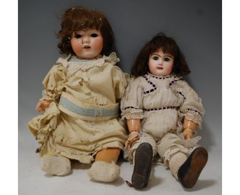 An Armand Marseille bisque head doll, eyes loose, having open mouth with top teeth showing, having bent limbed composition bo