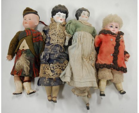 An Ernst Heubach bisque head doll in Scottish Highland dress, having square Heubach mark verso and numbered 2/07602, h.26cm; 