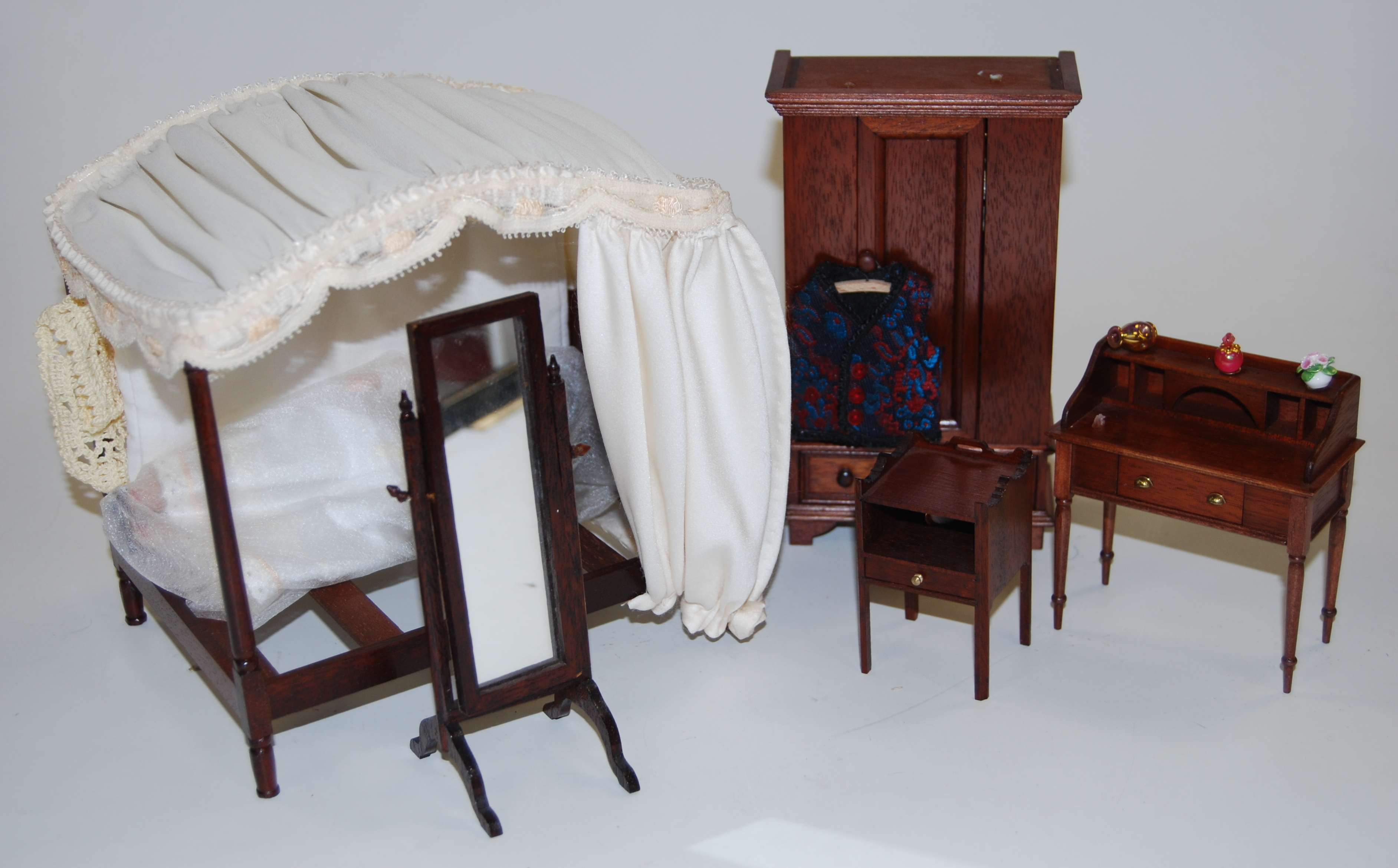 A large collection of dolls house dolls, furniture and accessories, to