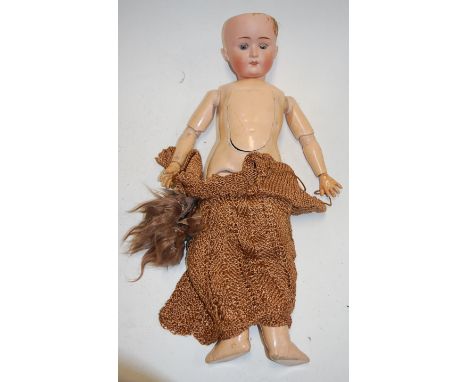 A William Goebel bisque head doll, having rolling blue eyes and open mouth with top teeth showing, with jointed composition b