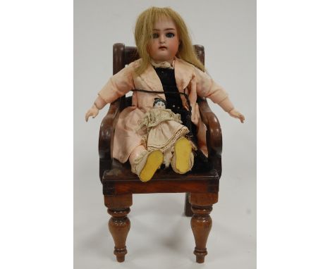 A Kammer & Reinhardt for Simon & Halbig bisque head doll, having rolling blue eyes and open mouth with four top teeth showing