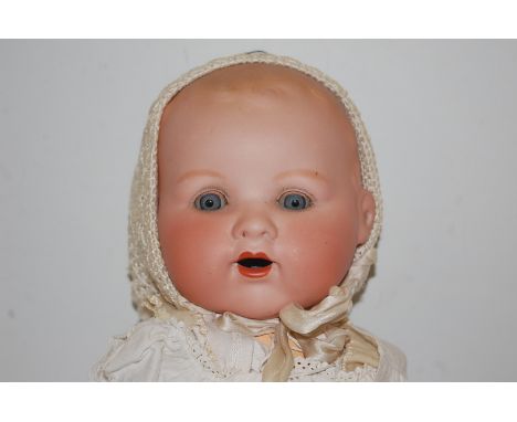 An Armand Marseille bisque head doll, having rolling blue eyes and open mouth, with bent limbed composition body, stamped AM 